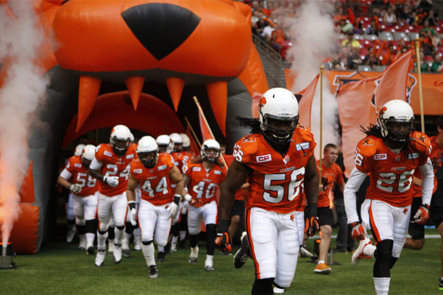 Football players coming onto the field