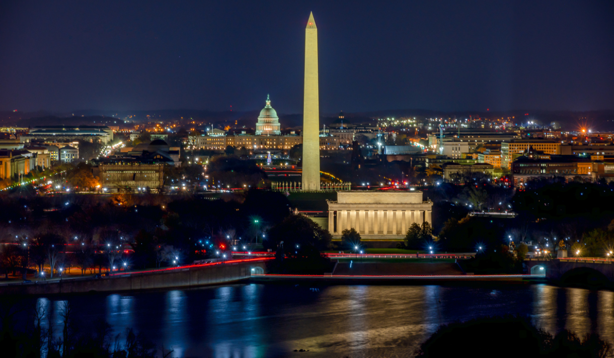 The Washington, D.C., skyline at night, showing the Washington Monument