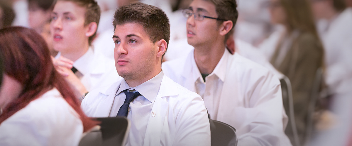 A group of medical students are listening to a lecture.