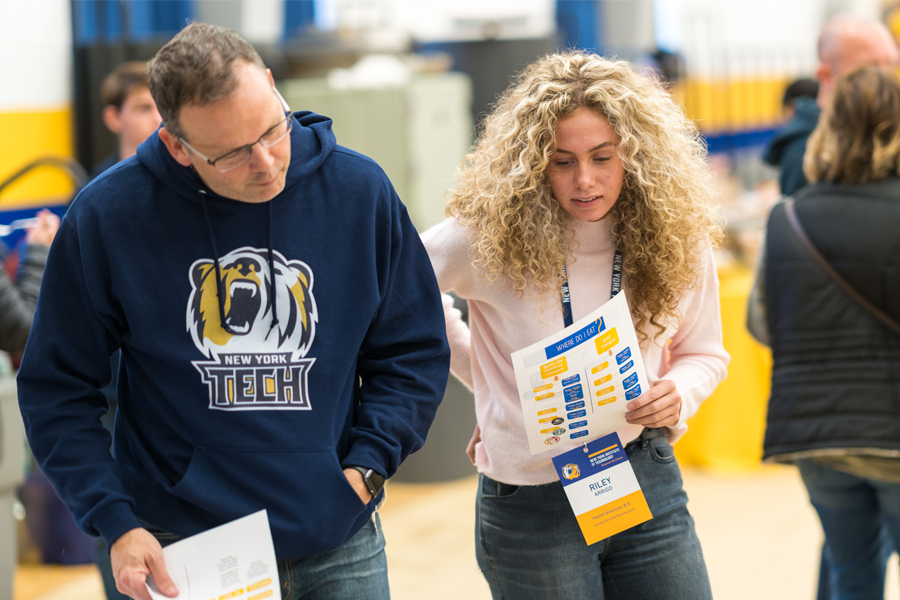 Two students at a graduate admissions event.