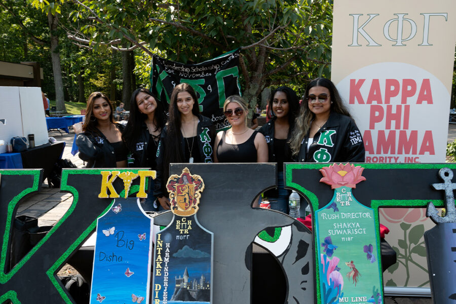 Students in Greek life at a table.