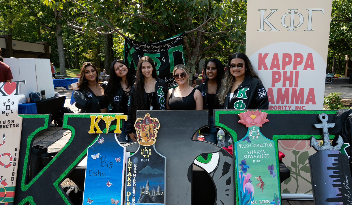 Students in Greek life at a table.