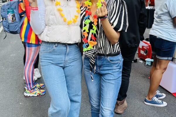 Two students smiling and posing for the camera.