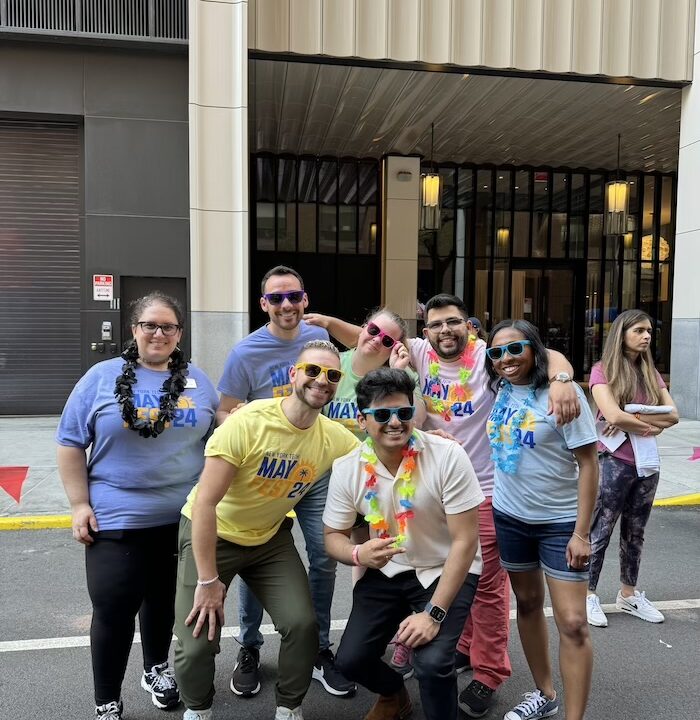 Group of students in front of Manhattan building posing for photo