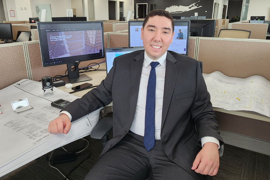 Khalid Hachil sitting at a desk