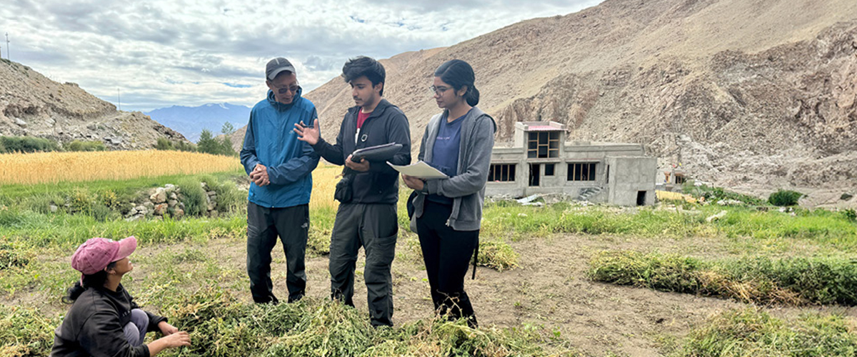 New York Tech students talking to a farmer