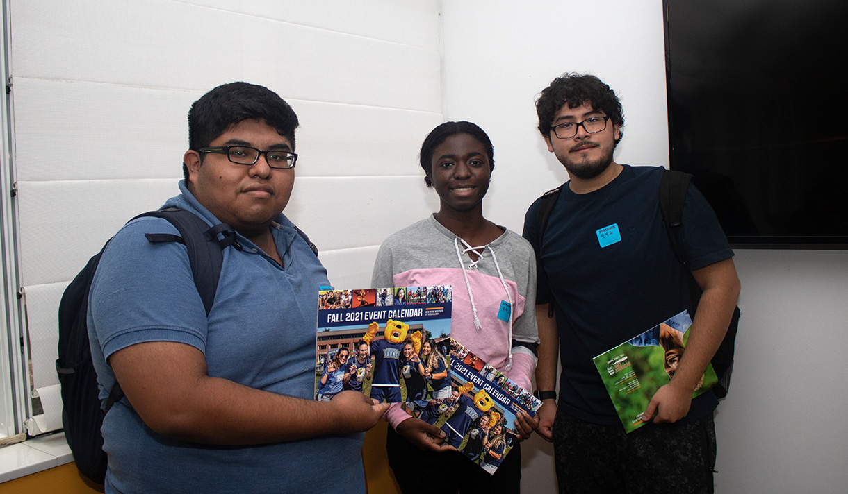 Three students posing for a picture.