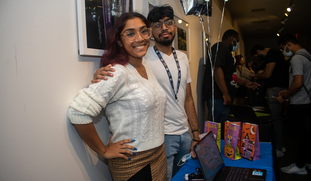 Two students at a booth.