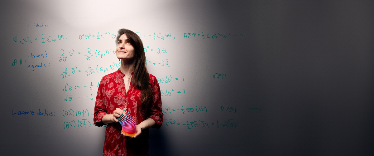 Portrait of a physics professor showcasing physics in action with a slinky.