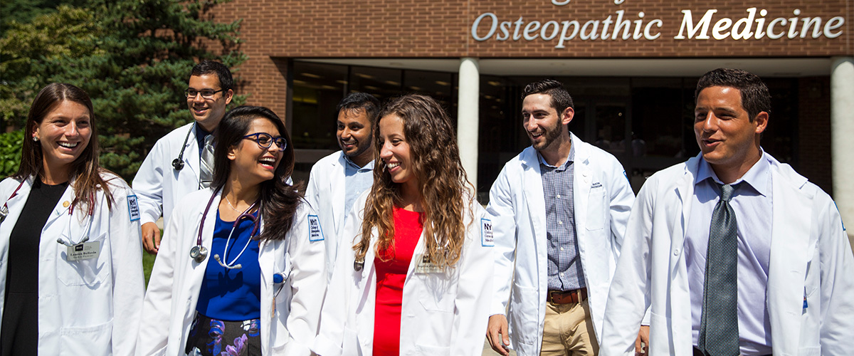 Group of medical students leaving building.